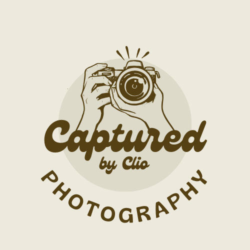 Logo of Captured by Clio with a beige background, brown writing saying Captured by Clion photography and a camera.